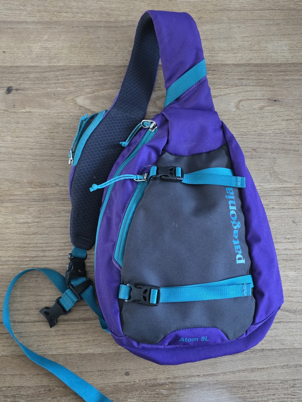 Patagonia purple and teal sling belt bag